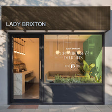 Storefront Sign Mockup - Cruzada Supply 1.png