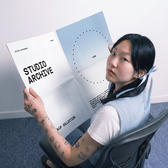 Folded print in the hands - Studio Archive - T.BW Mockup Collection