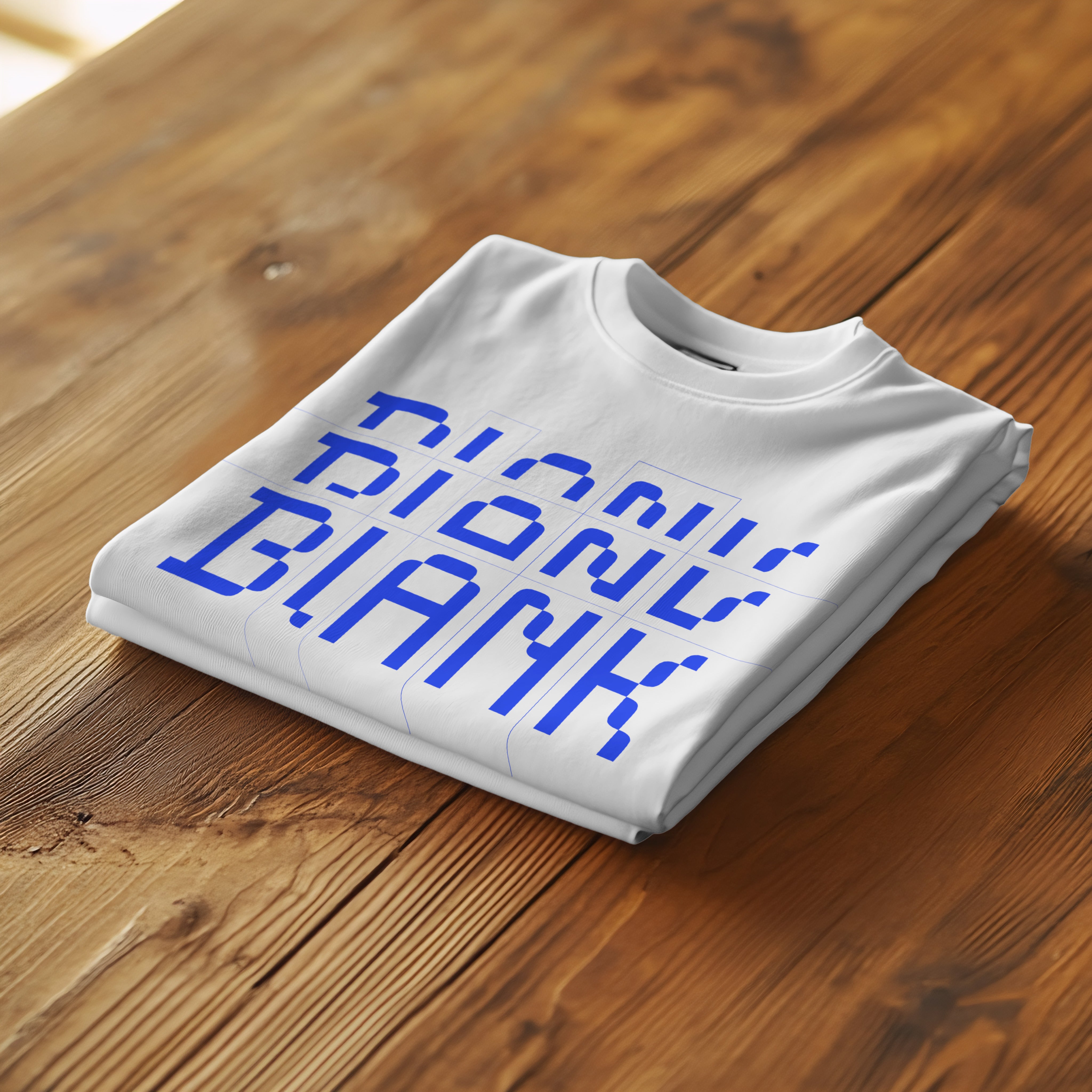 Folded T-Shirt On Table Photoshop Mockup