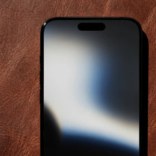 iphone-mockup-on-vintage-leather-surface-afterimagine-2.jpg